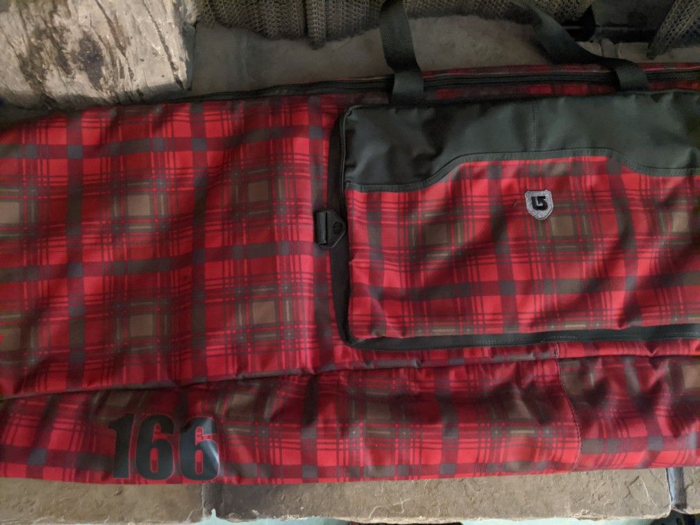 Snowboard, bindings, bag