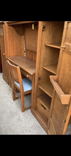 Very cute bedroom set. Twin headboard with overhead light and pegboard. Desk with chair. Two side lockers solid oak fits in a small bedroom nicely. Thumbnail