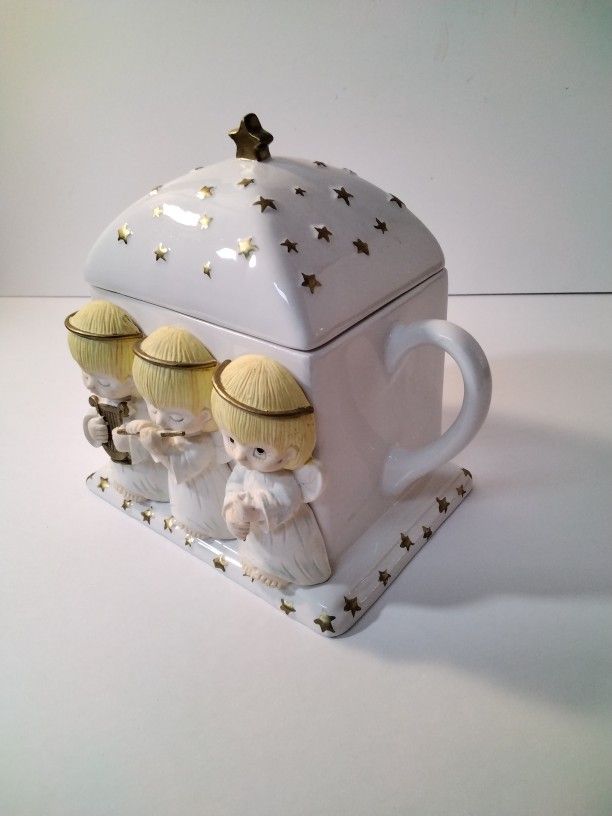 A Beautiful Tea Pot With Angels .