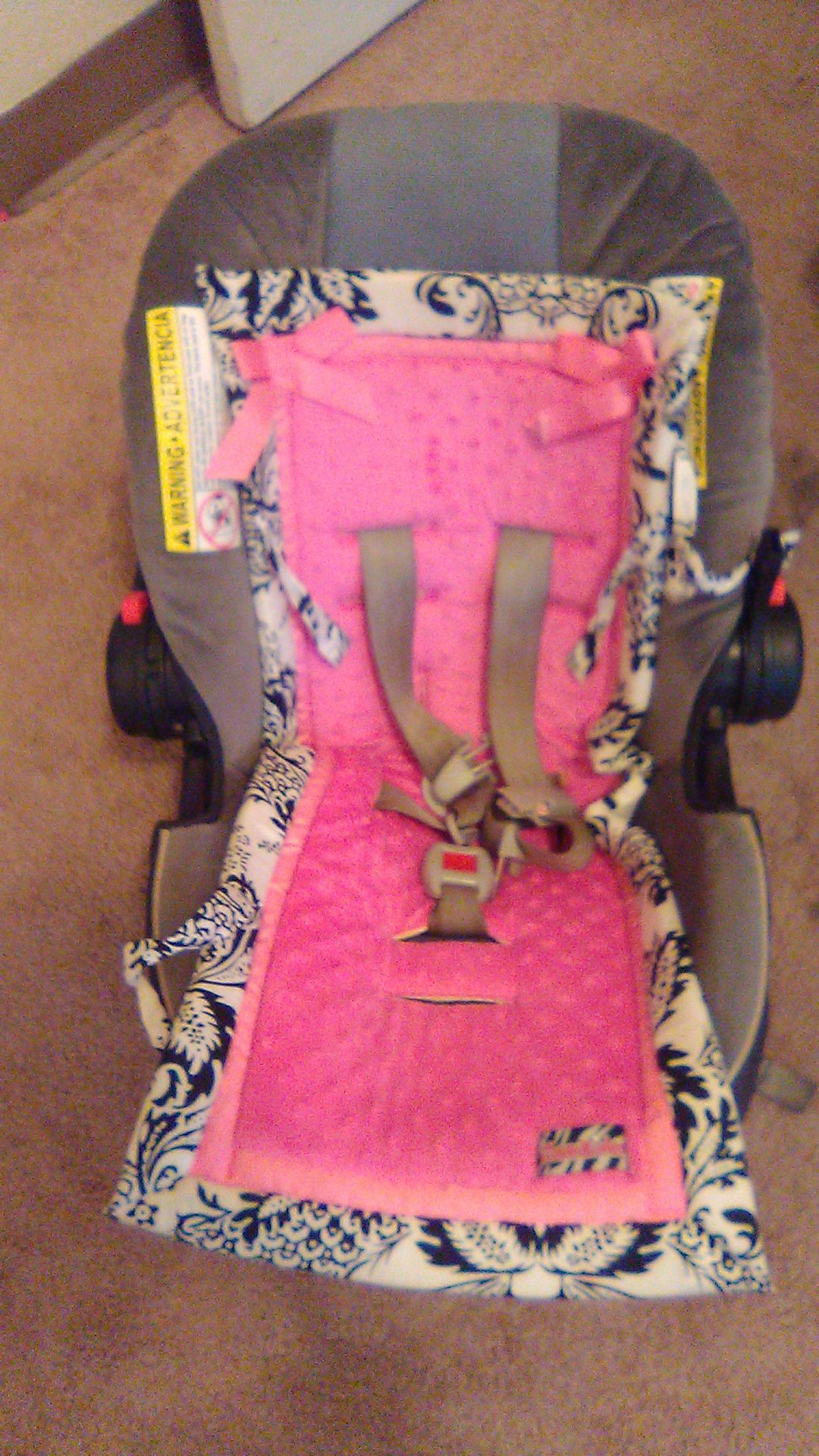 Graco car seat with pink seat cover