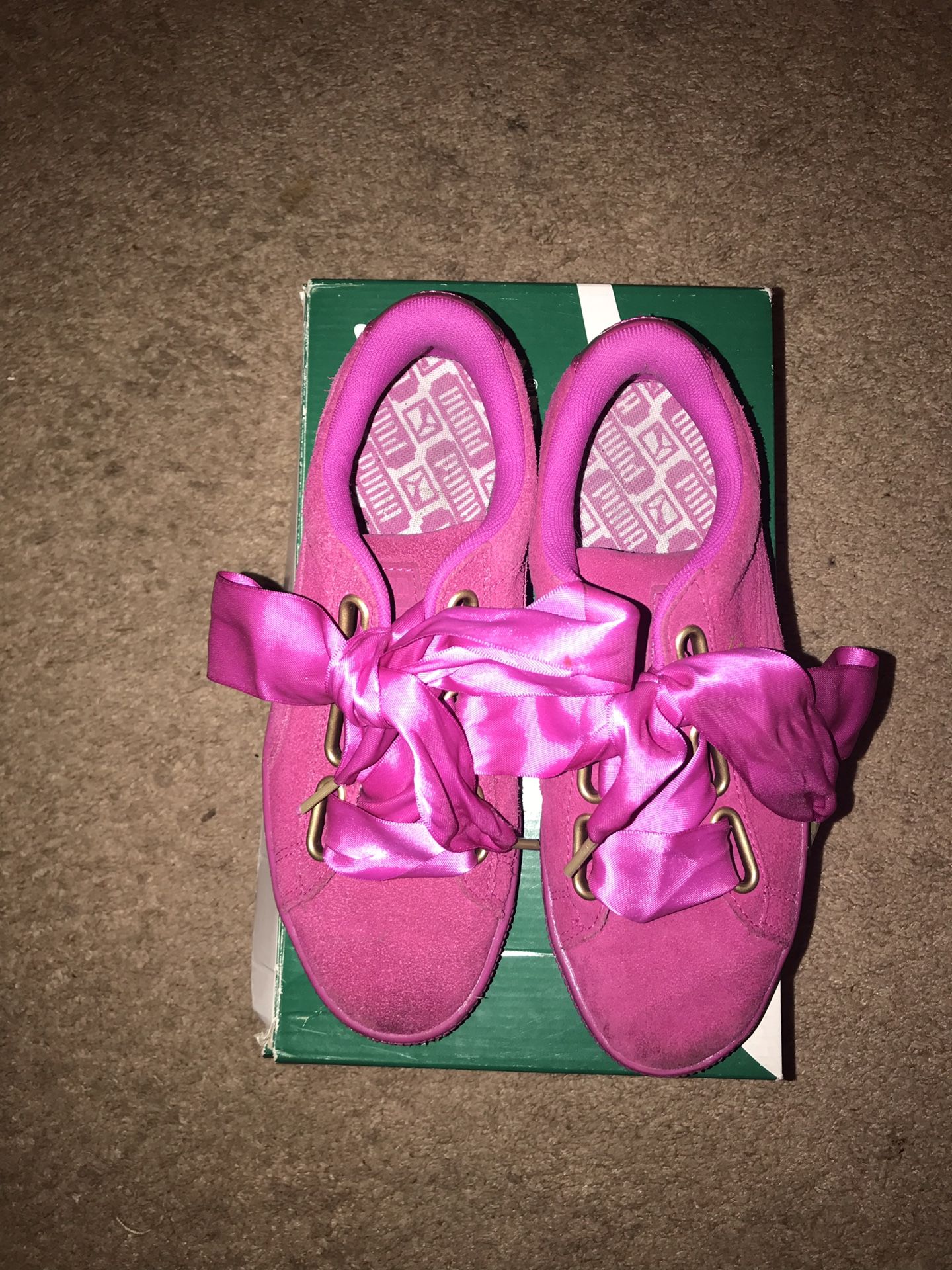 Gently used size 7 hot pink puma shoes with satin bow laces