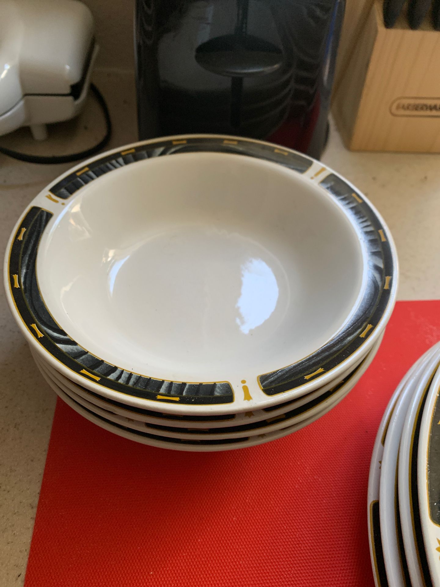 Two coffee cups two small bowls for medium bowls three large bowls three small plates four medium plates and four large plates