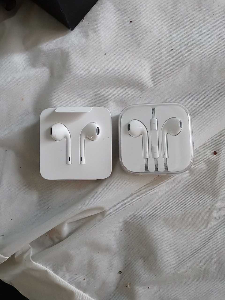 2 sets of Apple ear buds iphone and iphone 5 s