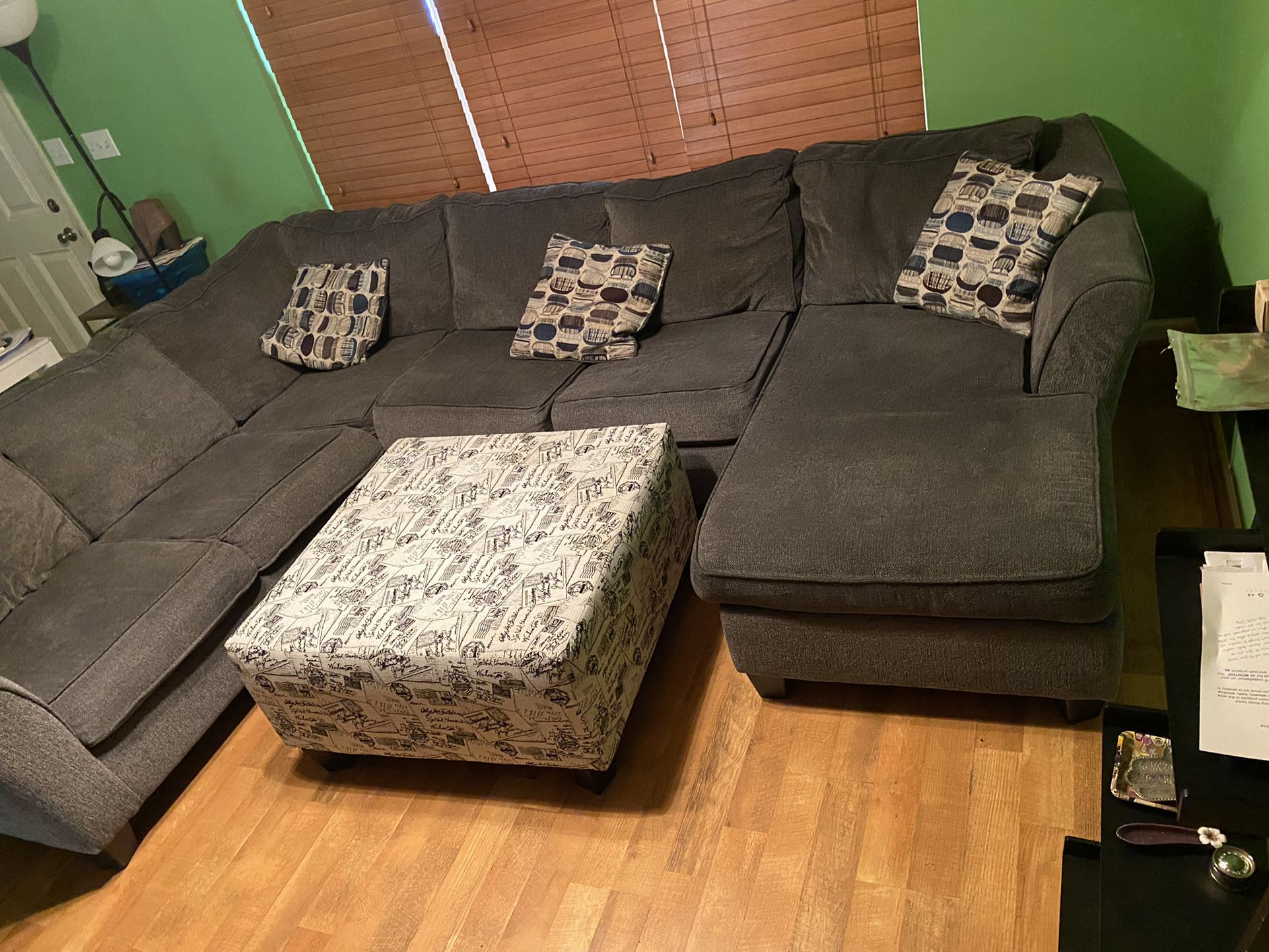 Large Grey Sectional With Stylish Ottoman