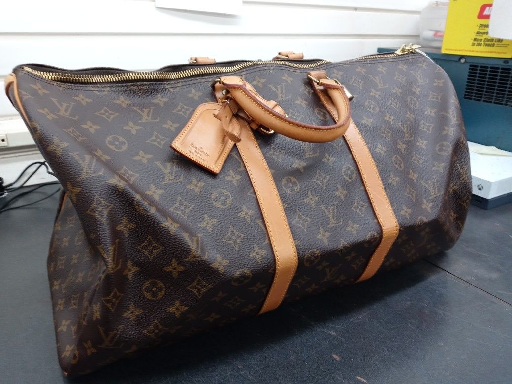 Louie Vuitton Duffle w/certificate