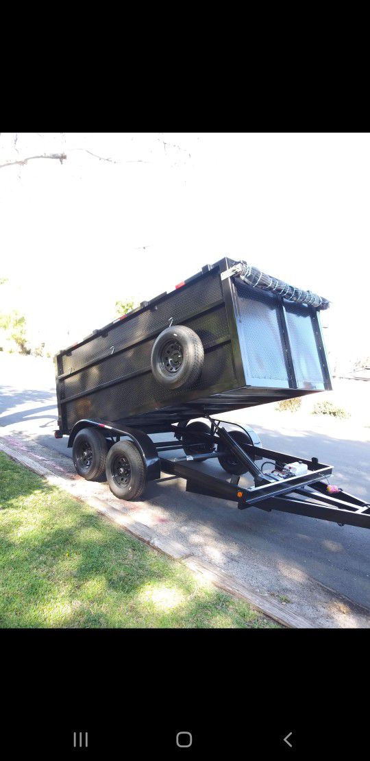 NEW DUMP TRAILER 12FT EQUIPPED ROLLING TARP AND SPARE TIRE REMOTE CONTROL ELECTRIC BRAKES LIGHTS,READY FOR WORK TITLE IN HAND FOR ANY QUESTION TEXT ME