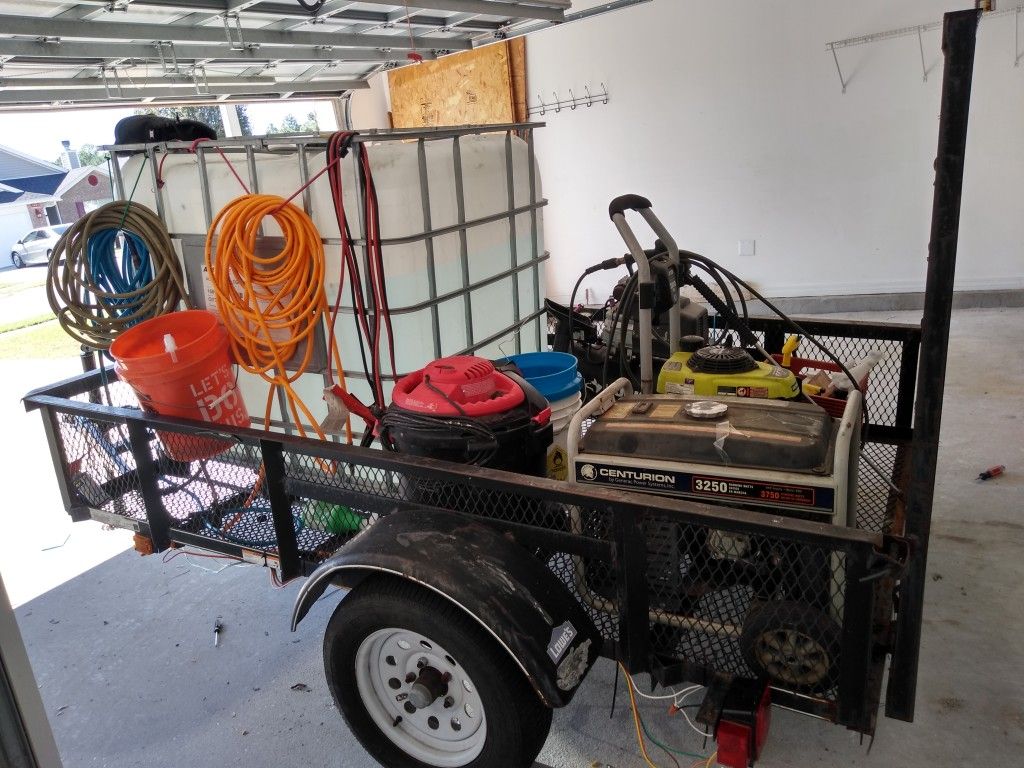 Black trailer with mobile detailing equipment