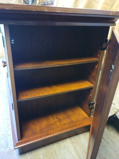 This beautiful well constructed heavy piece of furniture can be used as a entertainment center, TV stand, console table, etc.