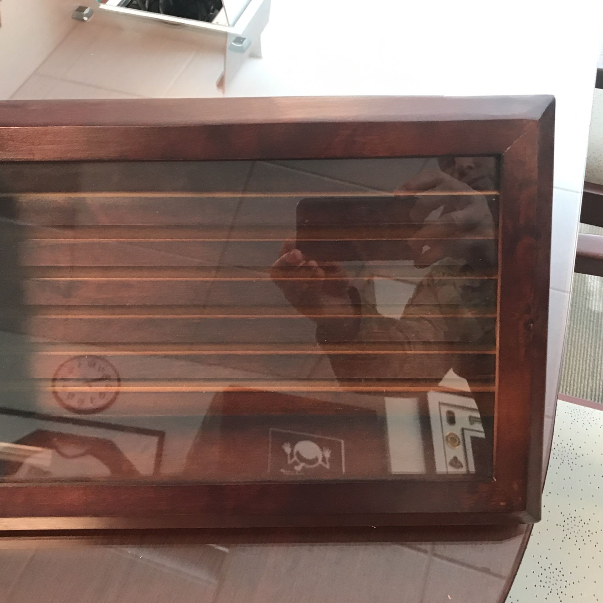 Two wooden coin boxes with glass covers