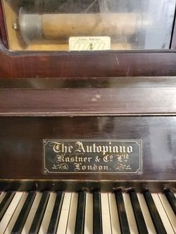 Player Piano With Music Scrolls Thumbnail