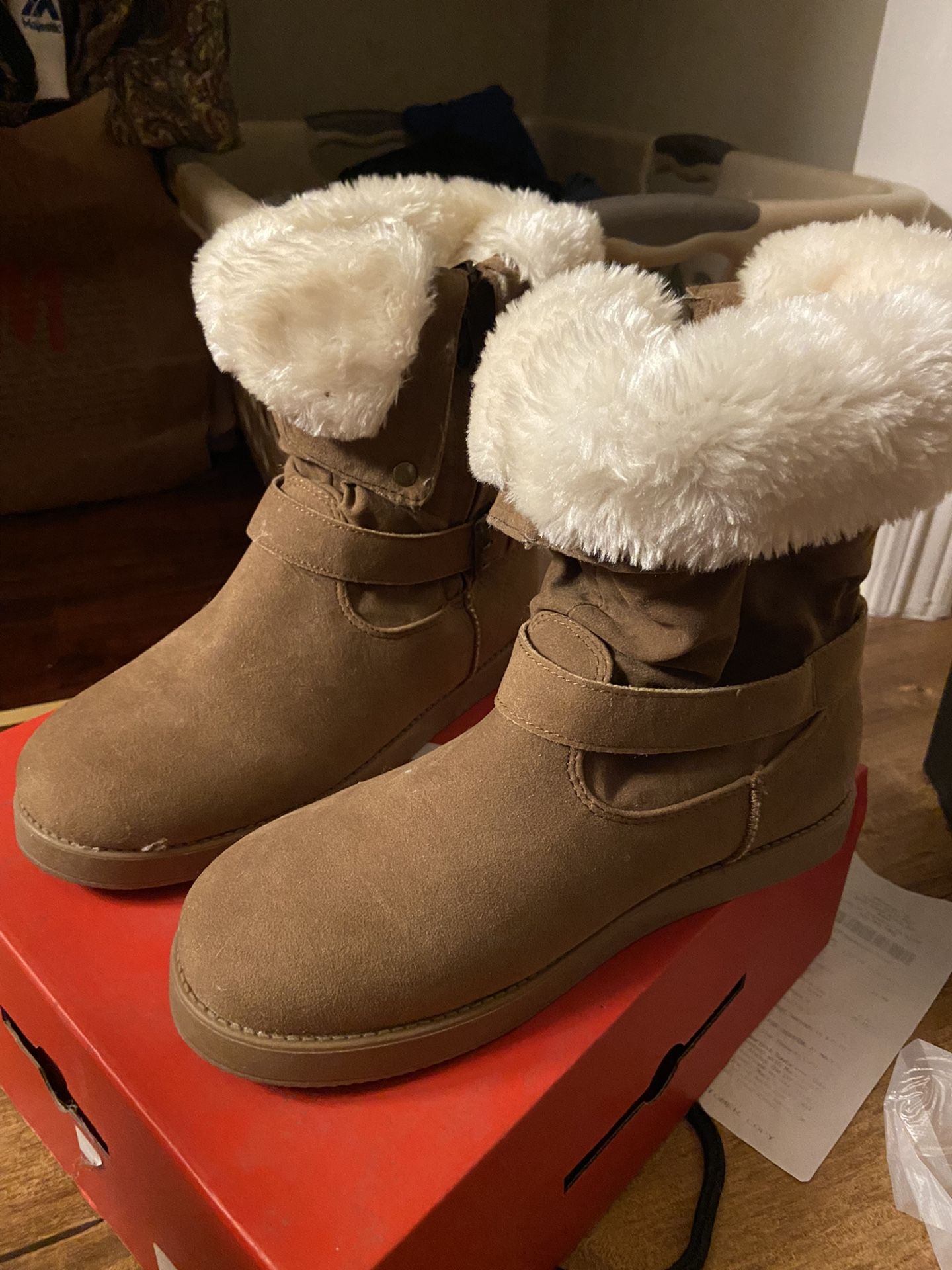 By Guess brown fur boot that is similar to UGGs