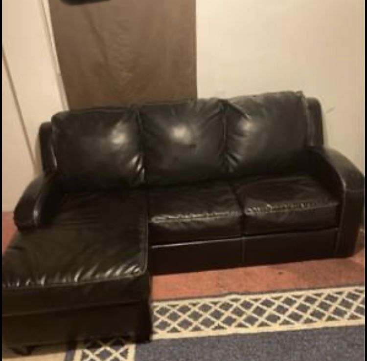 black leather sleeper ottoman sofa Folds Out To A Bed
