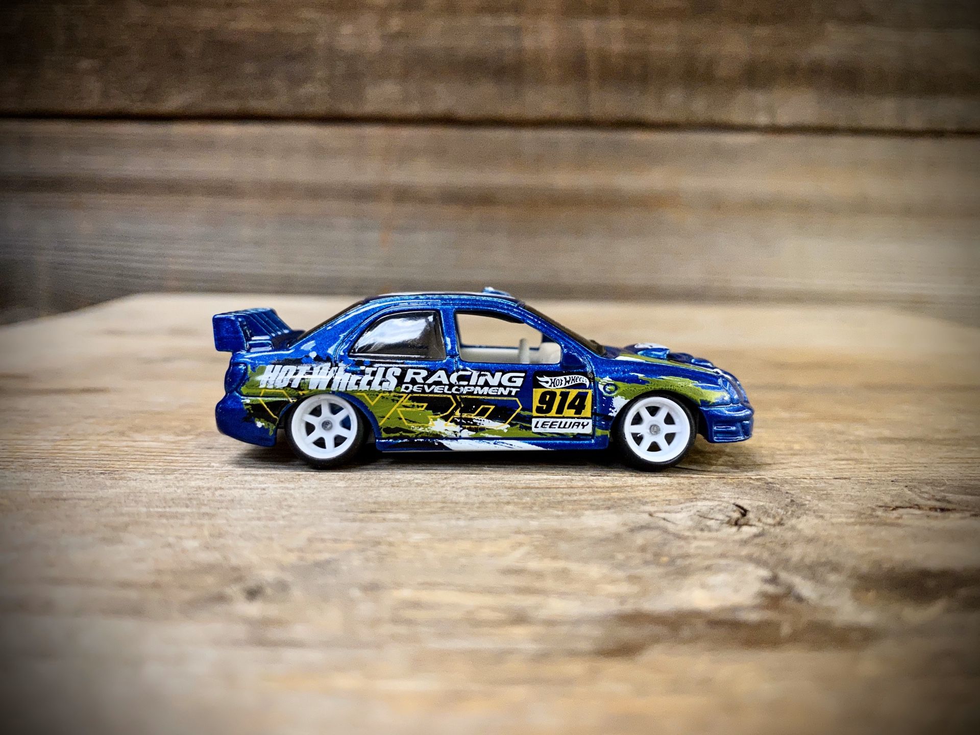 REPACKAGED CUSTOM 1:64 Subaru Impreza WRX - Hot Wheels (Lowered + camber with upgraded premium 7-spoke white wheels)