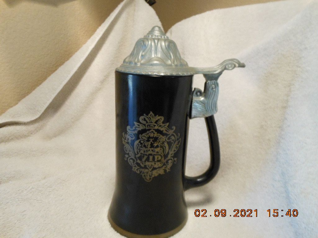 Narrow Lidded Beer Stein with a Crest and "VIP" on one side and a poem on the other side.