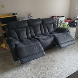 Reclining Couch With Charger Plugs. Cocktail Table Thumbnail