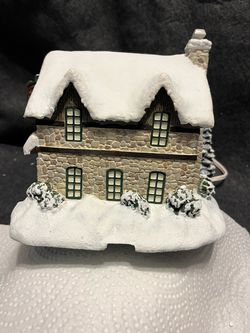 7  “Thomas Kinkade ‘s “ Village Christmas Collection , Each Come with cord that allows them to light up with switch Thumbnail