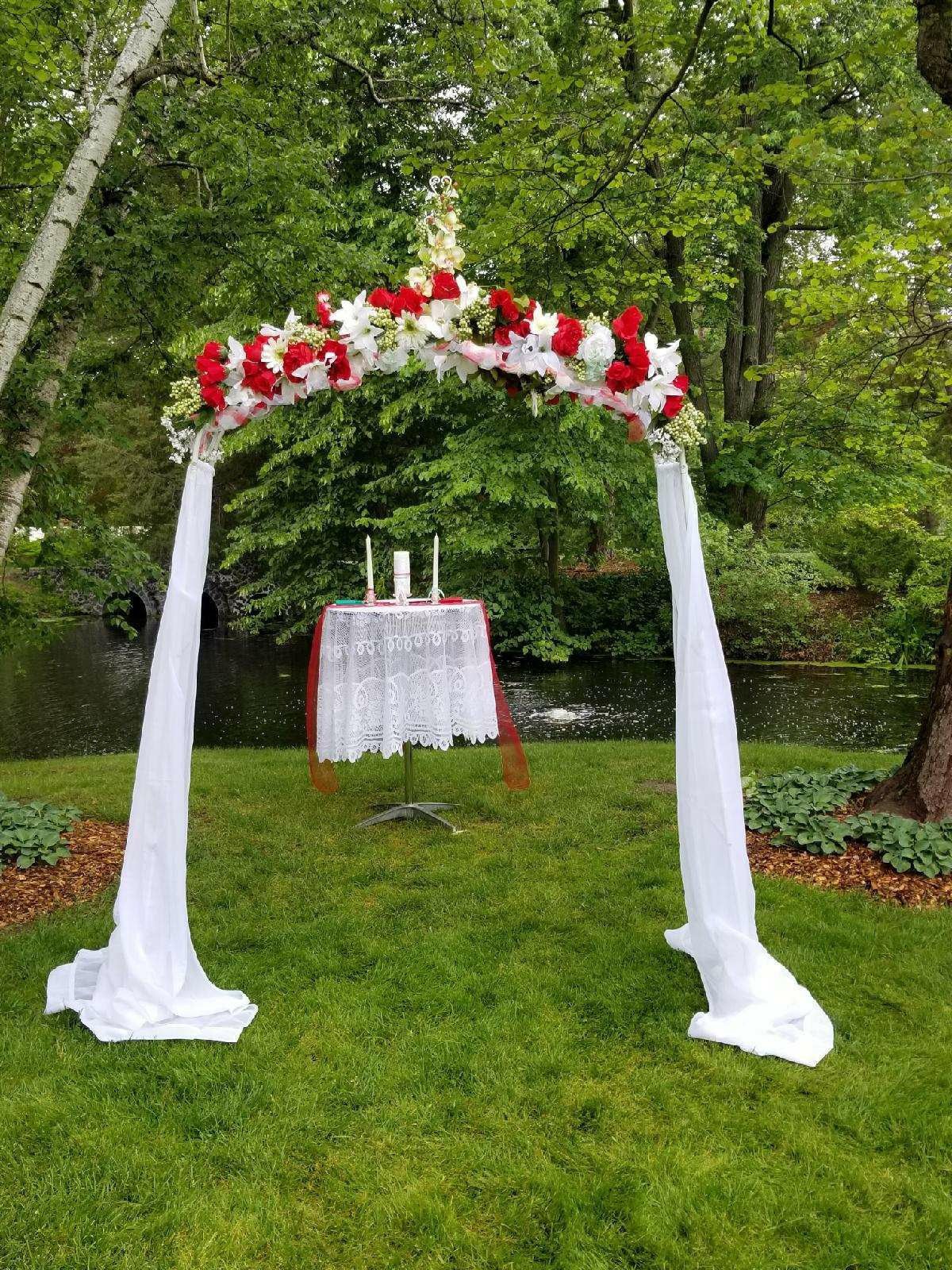 Wedding arch, flowers and draping included used once