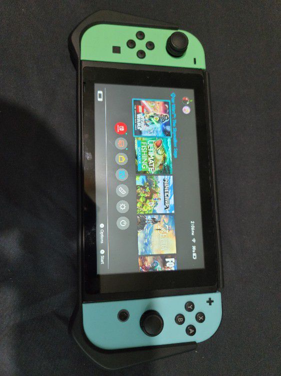 Nintendo Switch Animal Crossing Edition w/128GB sd card, Pro Controller, 4 games, and accessories
