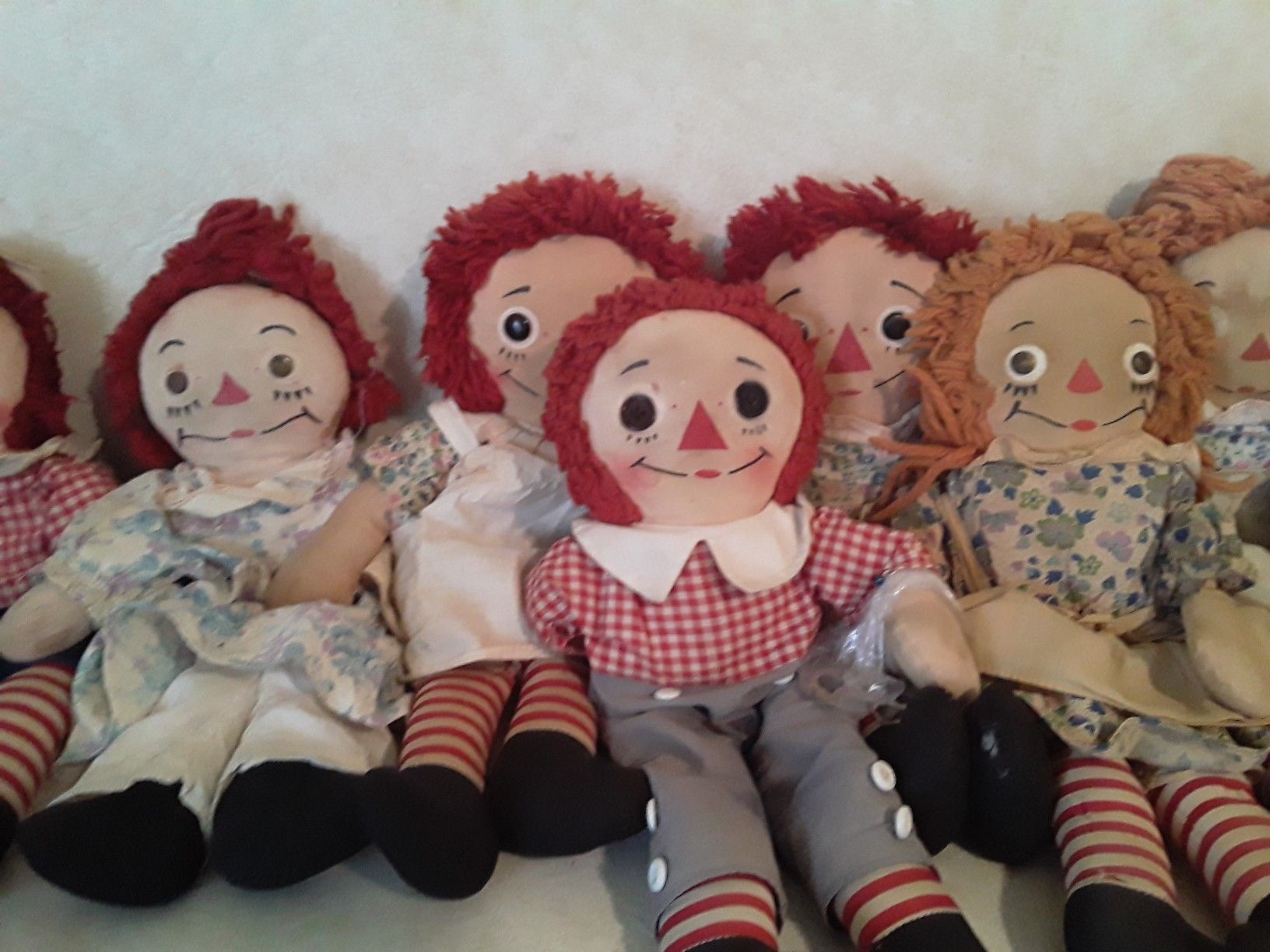 12 vintage Raggedy Ann and Andy Dolls