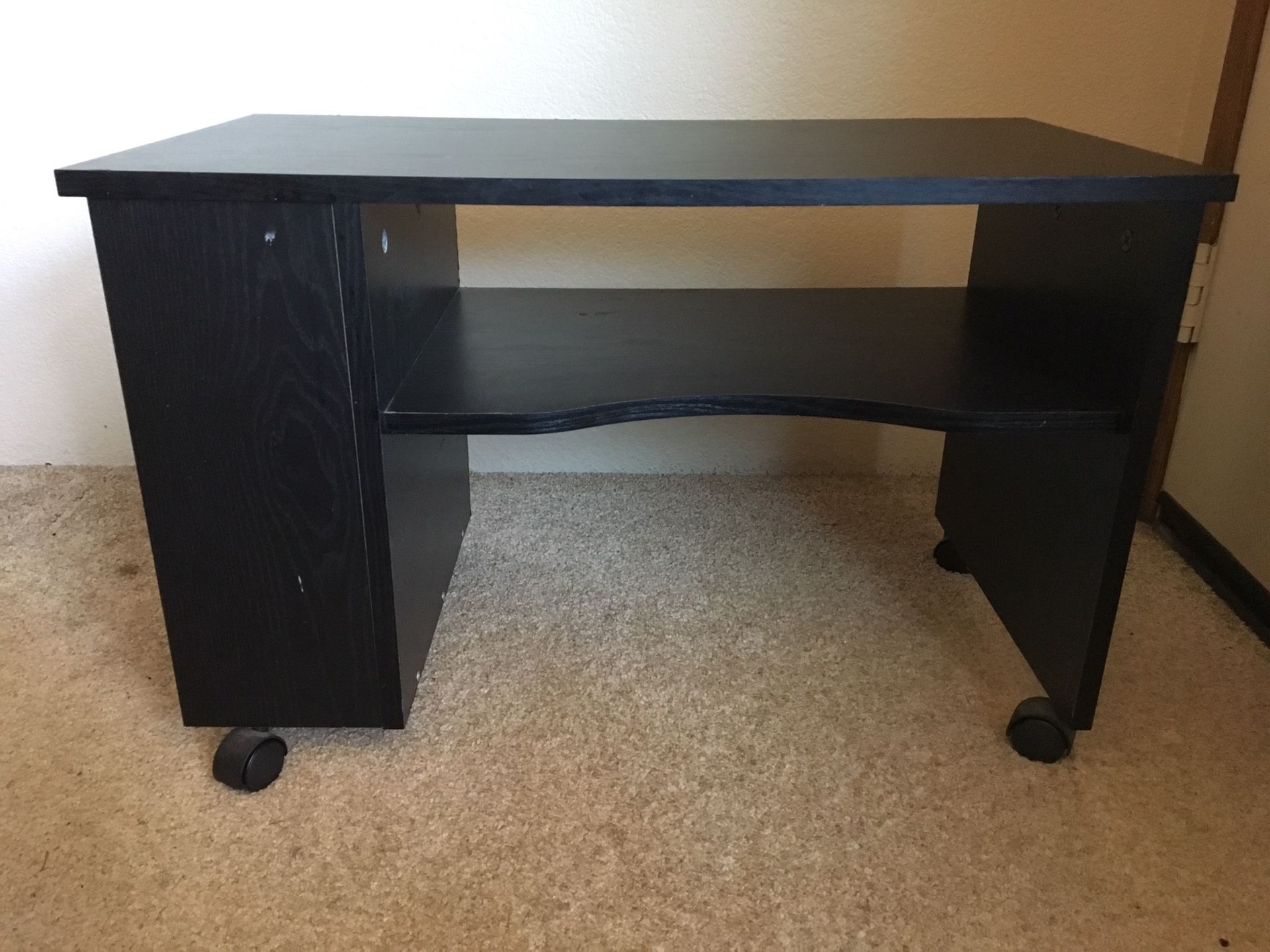 Small black stand with drawer.