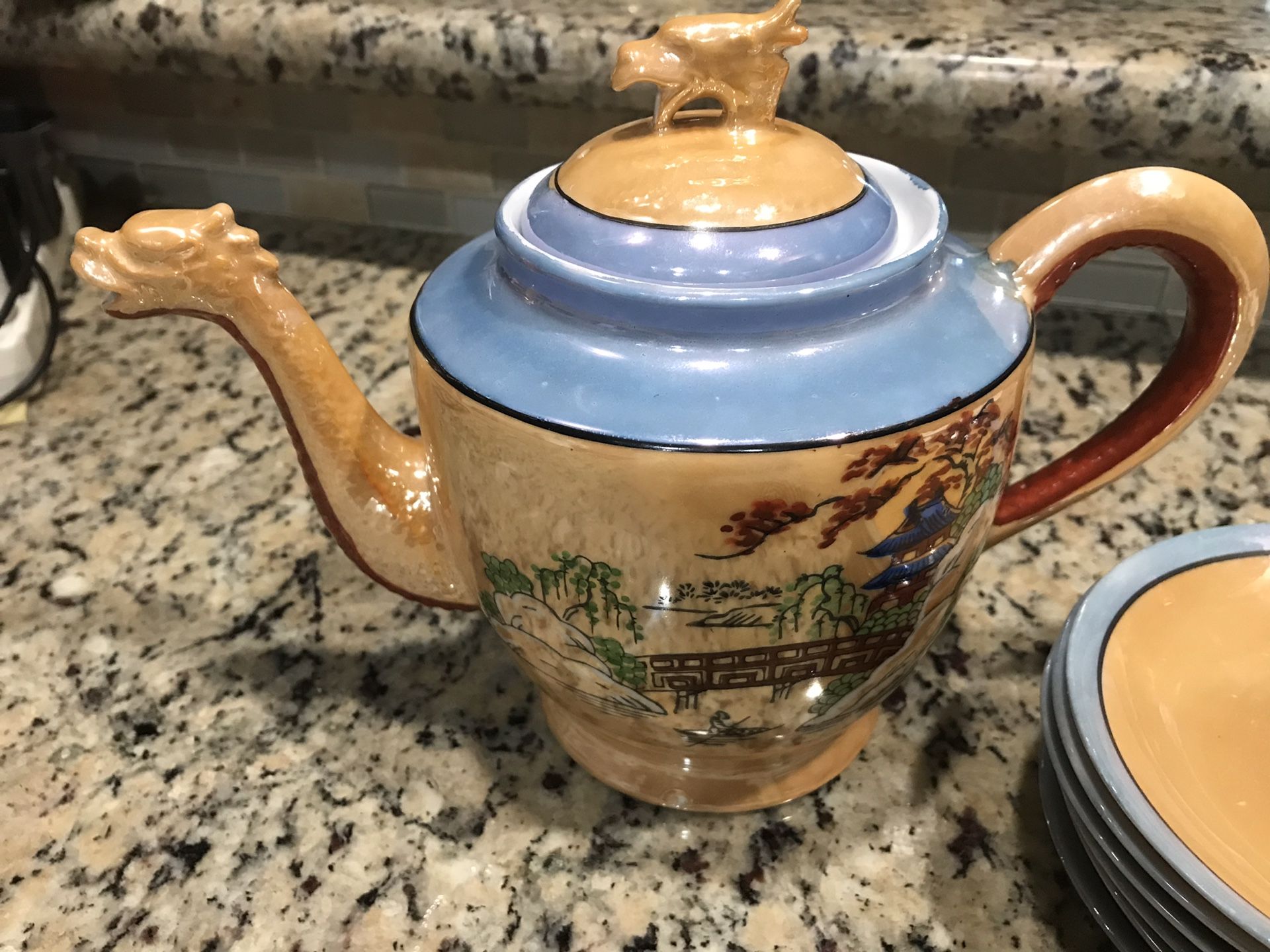 Antique dragon head tea pot and saucers. Asian oriental.