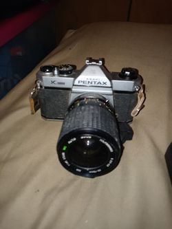 Asahi Pentax K1000 and a Time camera alot of attachments FYI the picture with price is only the camera with one lens I have 3 lens and the flash Thumbnail