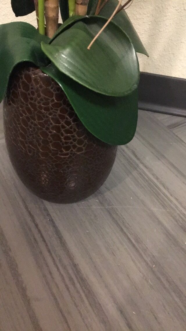 Fake orchid white flower house plant in pot