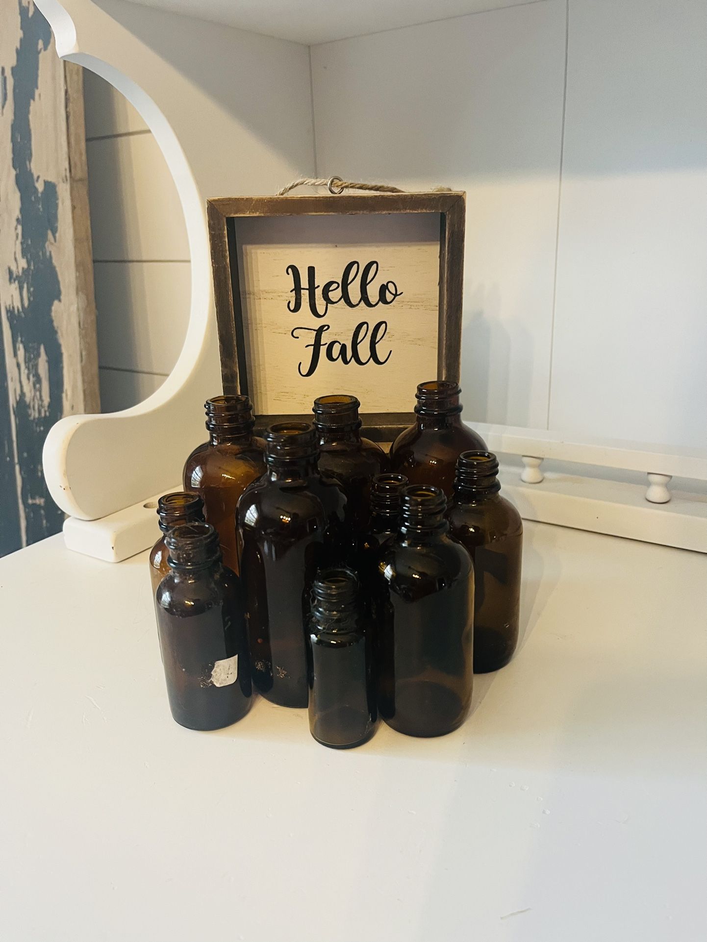 Small Amber Bottles And Small Sign