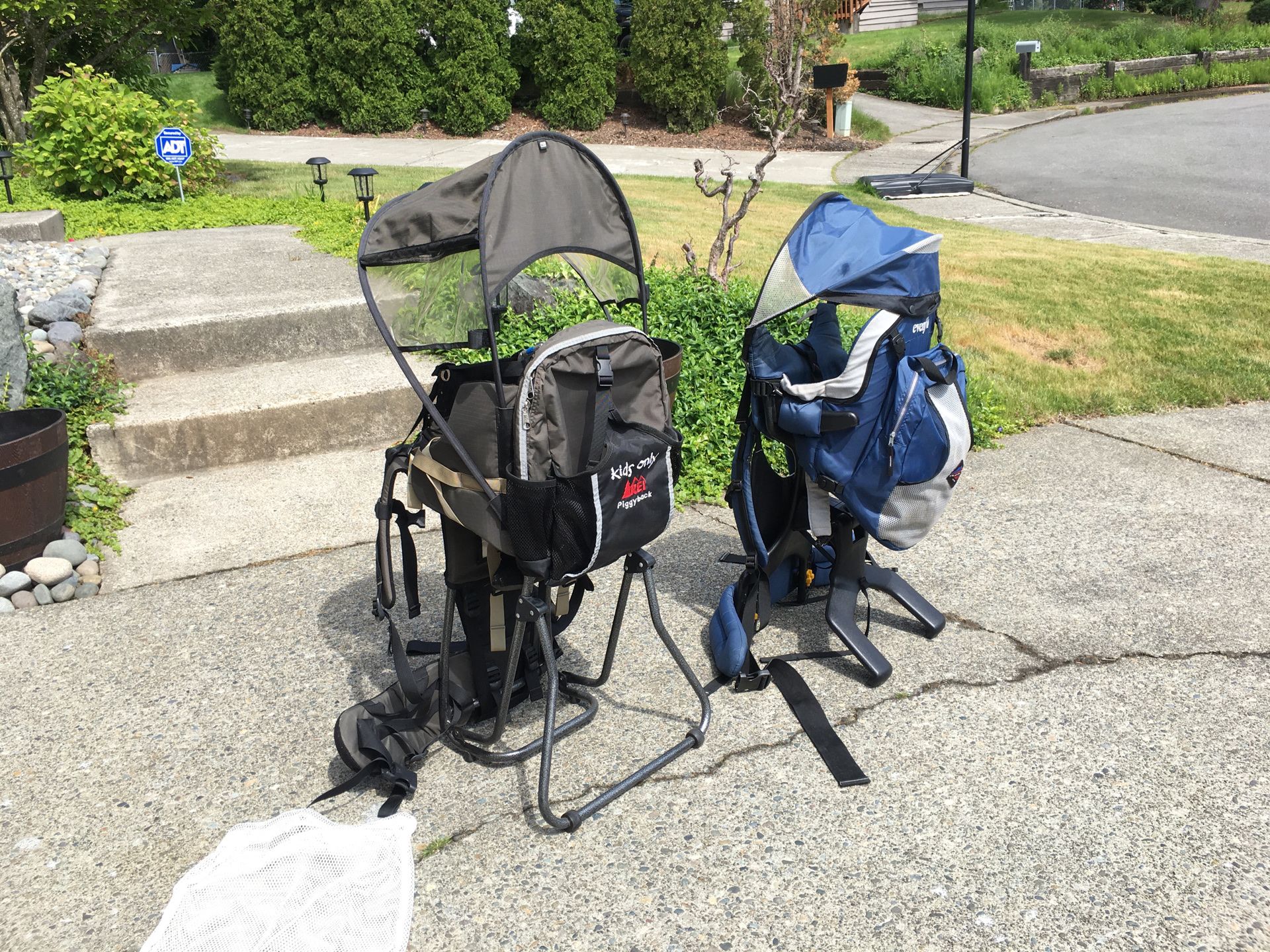 REI child carrier and Evenflo child carrier baby carrier with canopy sunroof or shade for Sale