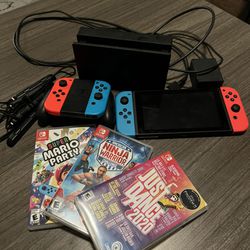 Nintendo Switch With 4 Joy Con Controllers & 3 Games Thumbnail
