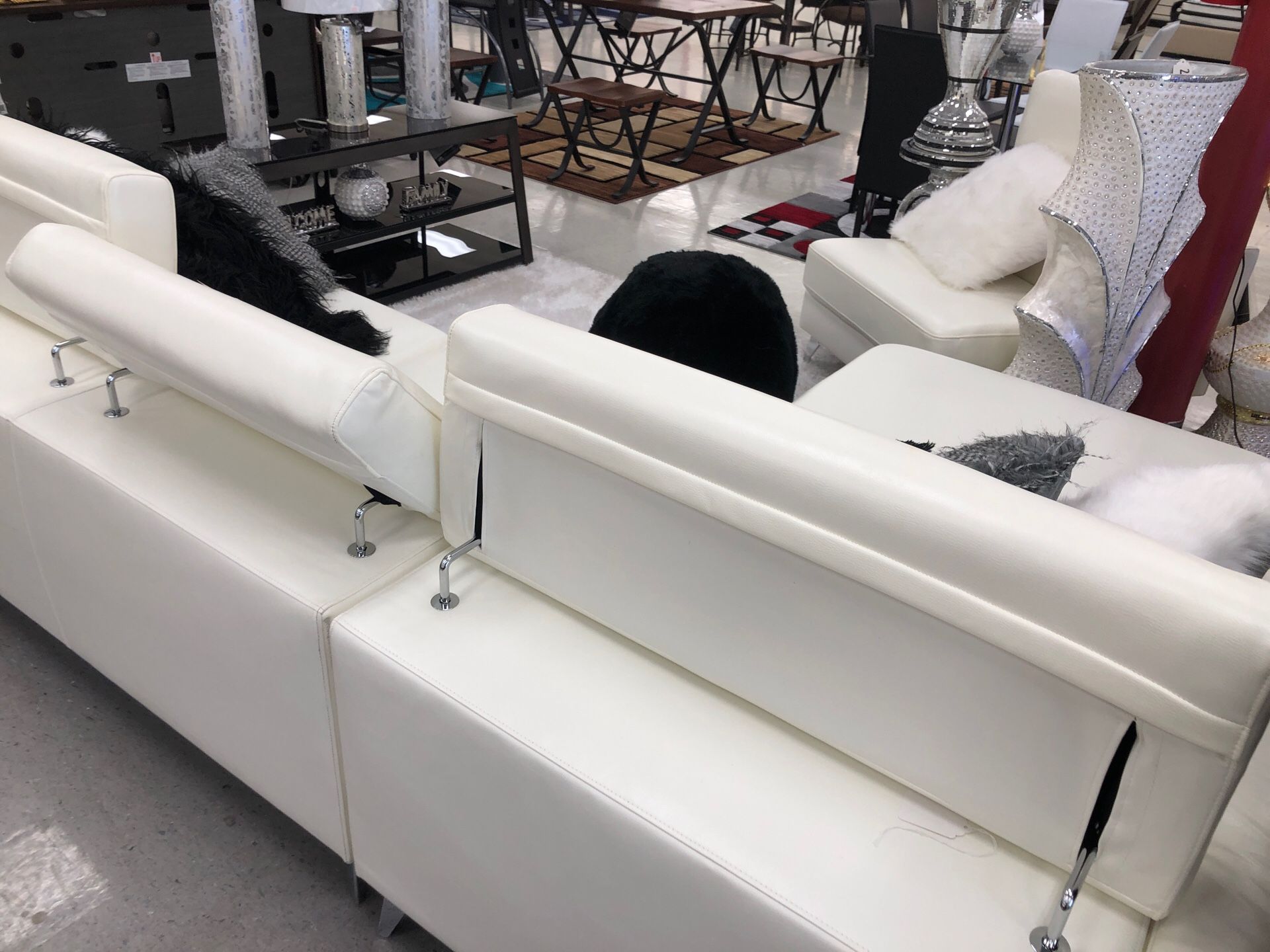White sectional with adjustable headrest