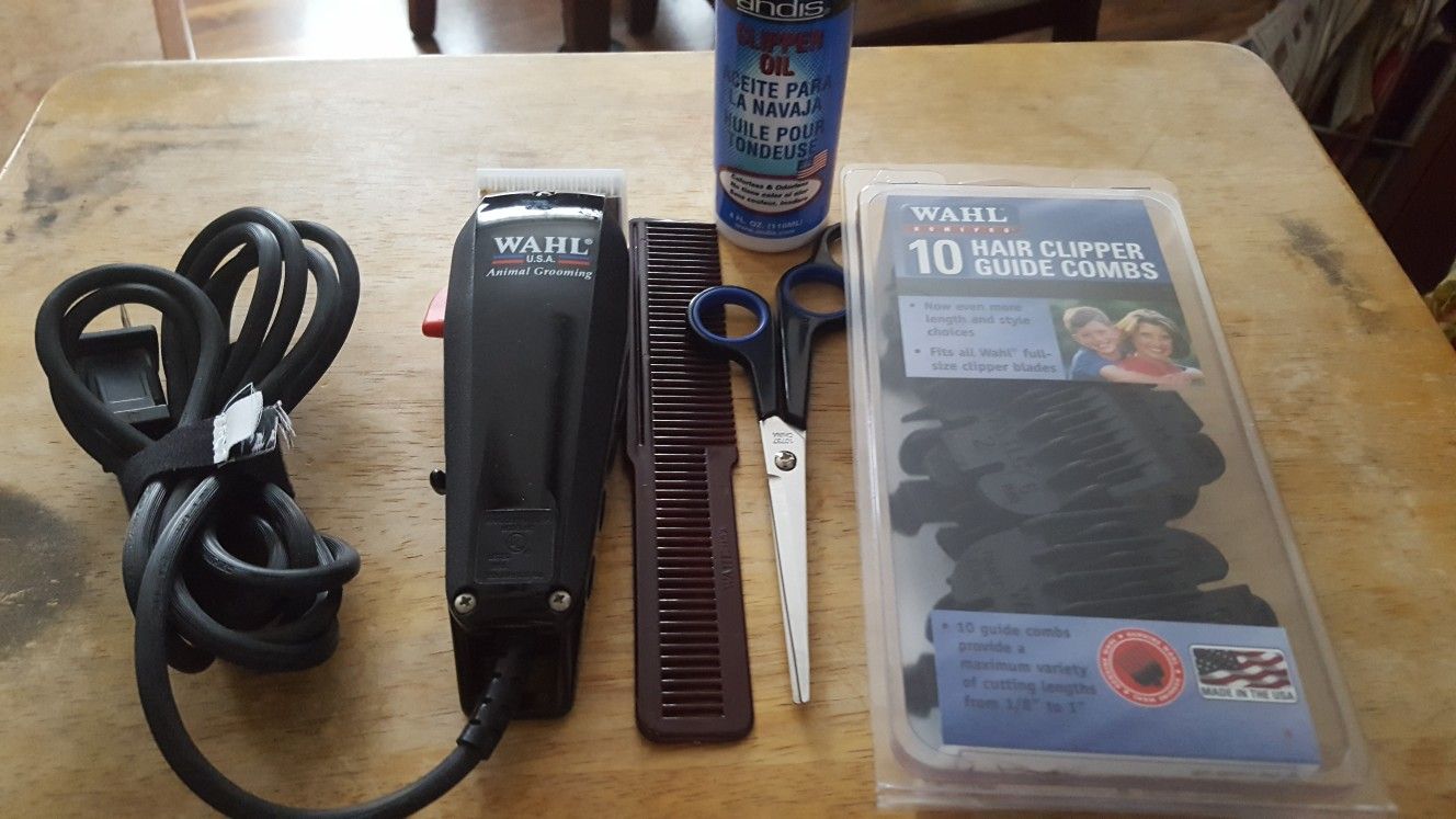 WAHL " DOG CLIPPERS WITH WAHL ATTACHABLE CLIPPERS AND OIL , SCISSORS , COMB YOUR READ TO CUTTING