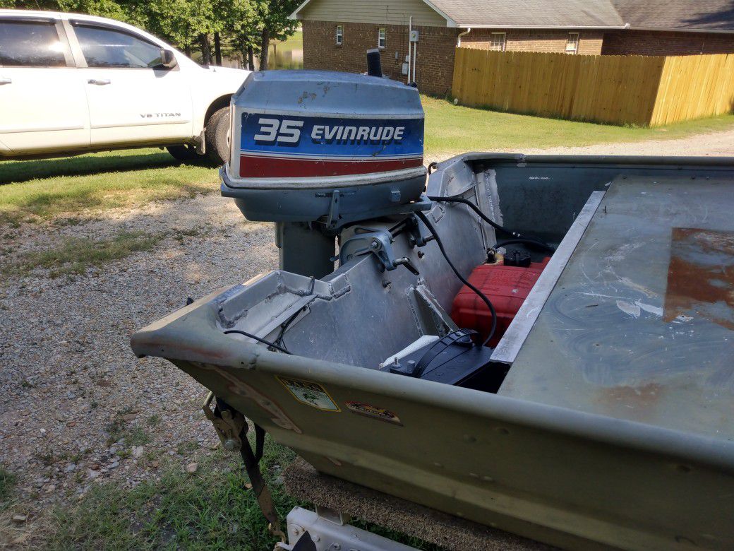 PolarCraft 15' 48" bottom with 35 horse Evinrude and trailer