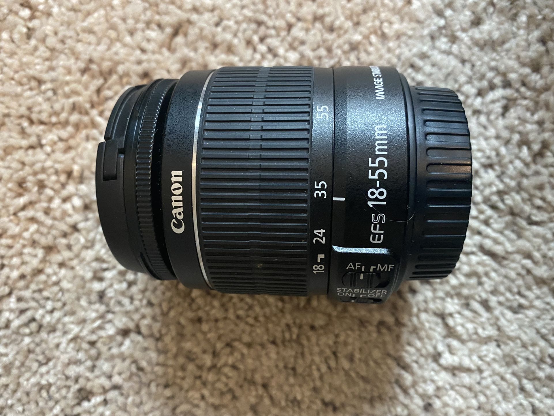 Excellent condition Canon EOS Rebel camera with two lenses, battery charger, and large camera bag.