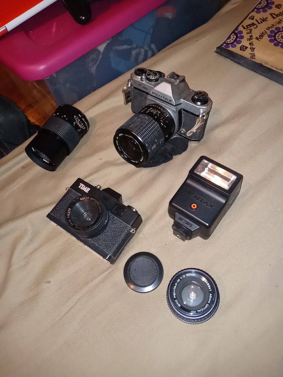Asahi Pentax K1000 and a Time camera alot of attachments FYI the picture with price is only the camera with one lens I have 3 lens and the flash