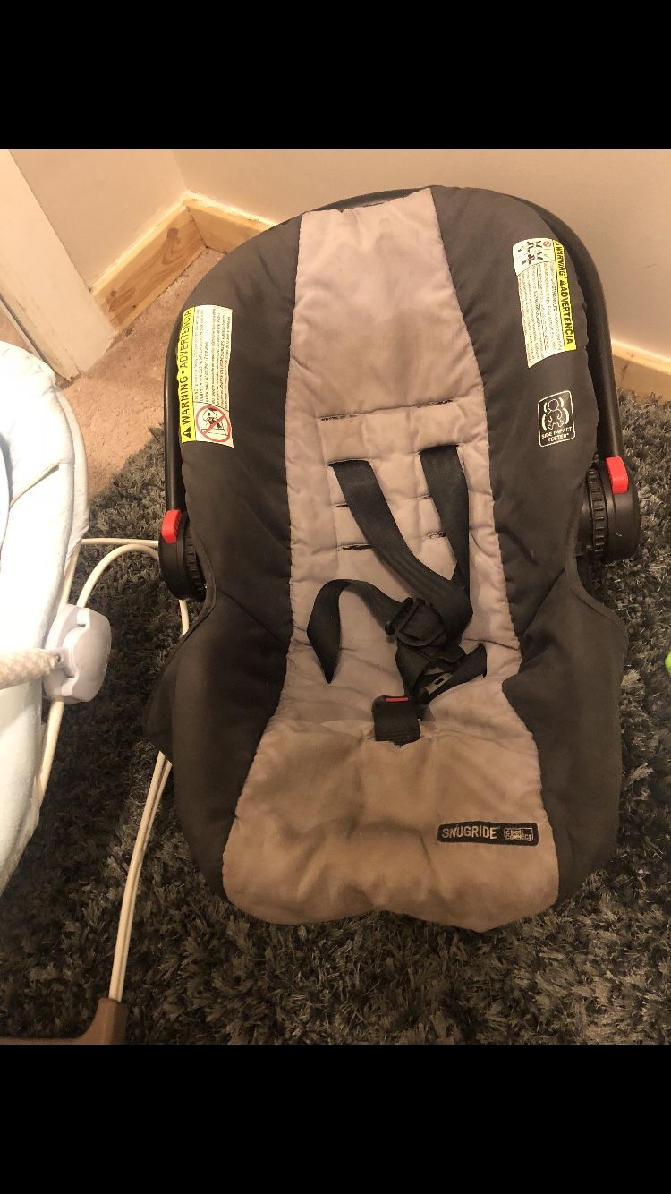 Baby bed, mattress, bouncer, activity seat , 3 bags of baby cloths car seat and excersor