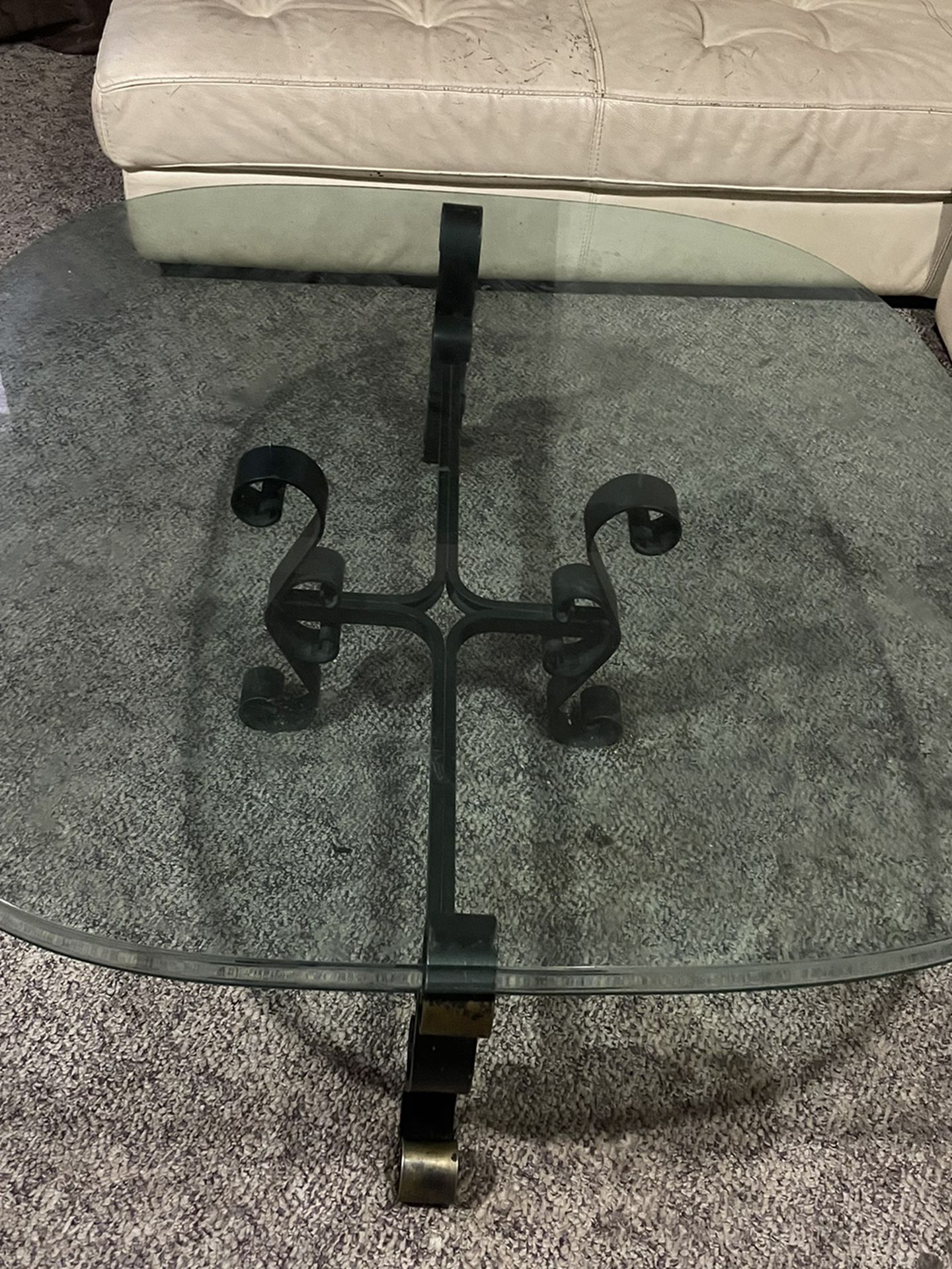 Heavy Duty  Glass Coffee Table. Has A Metal Stand. Glass is very thick. Great Condition 