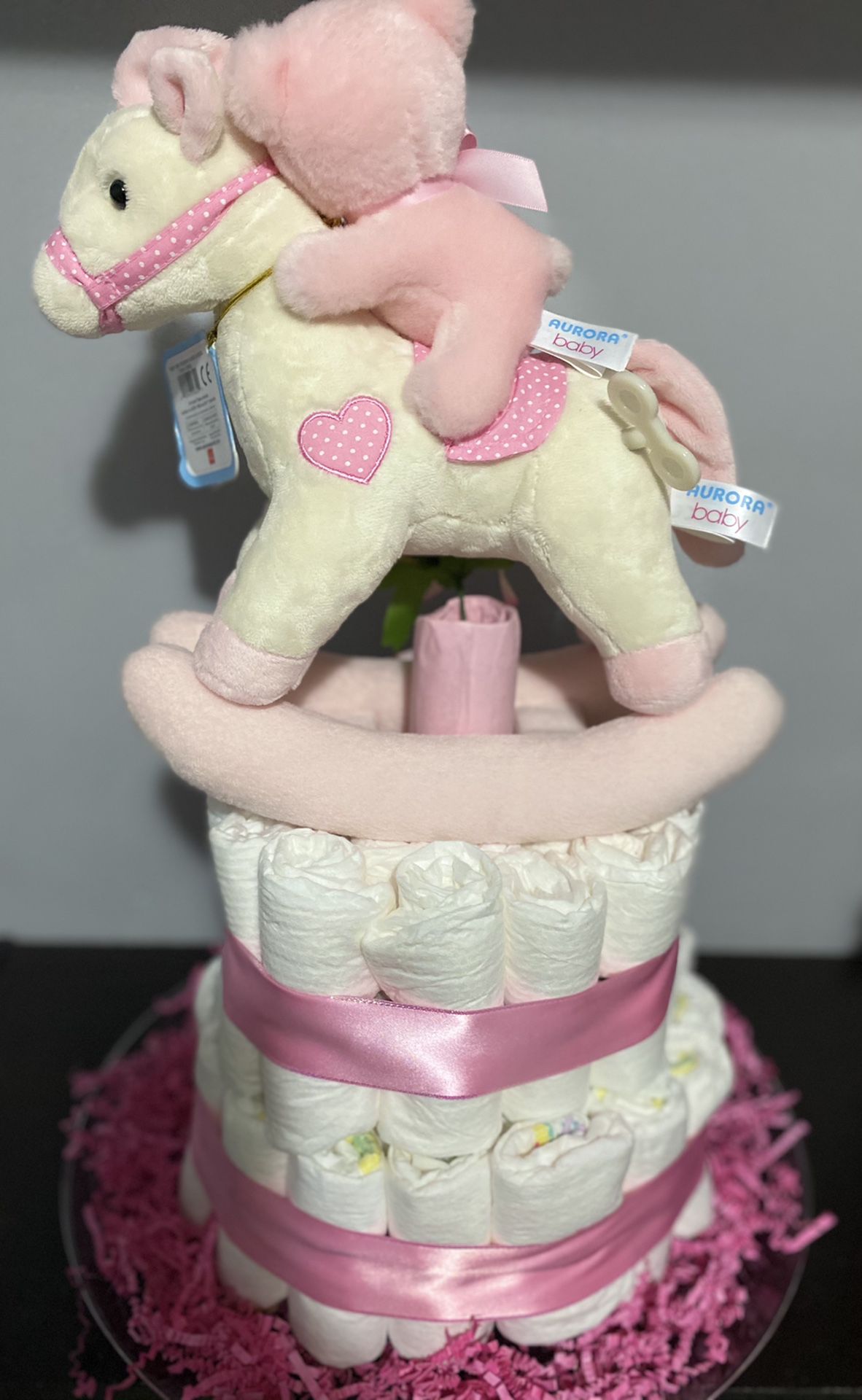 Diaper cake with musical toy