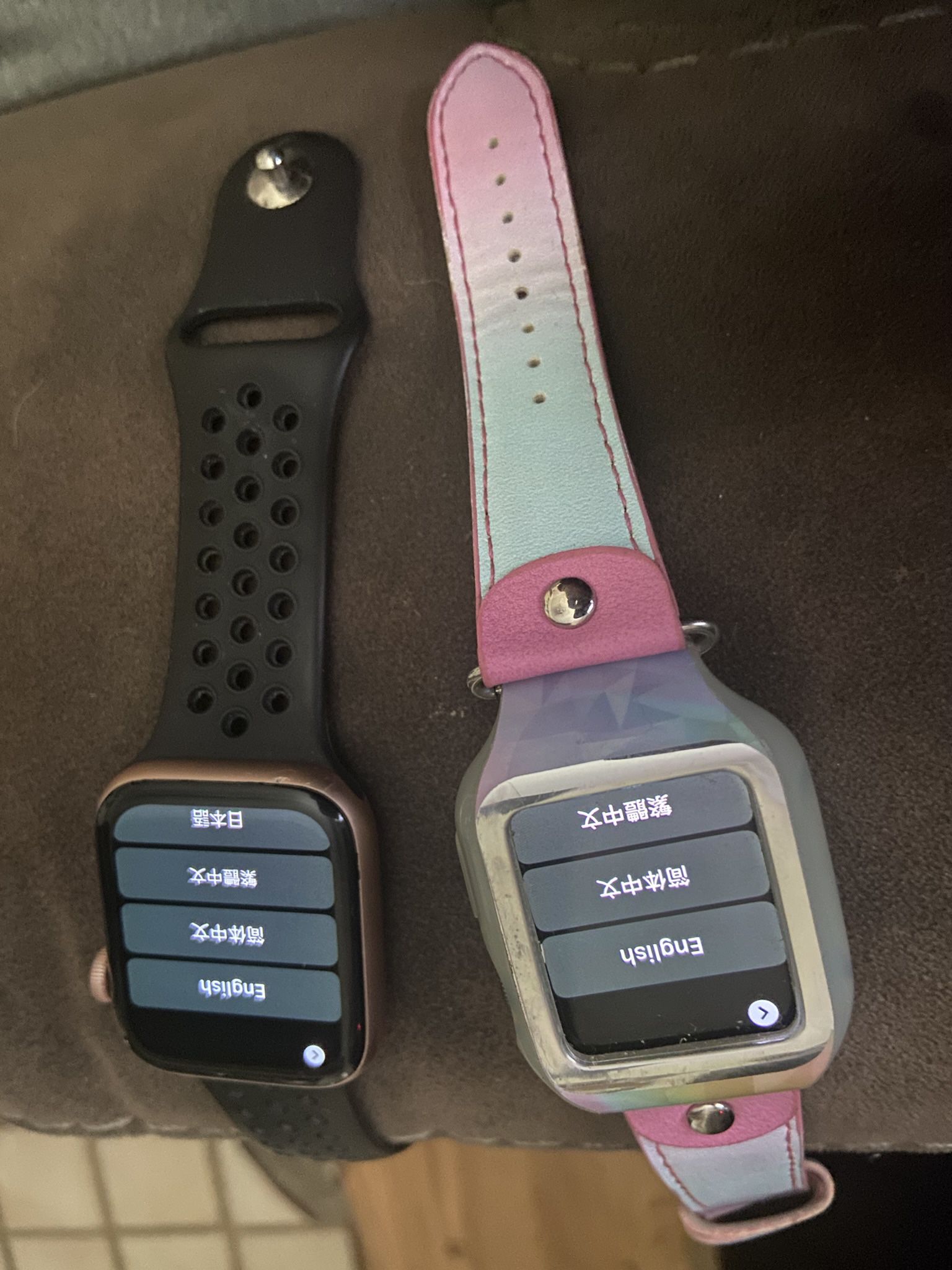 2 Apple Watches With cases