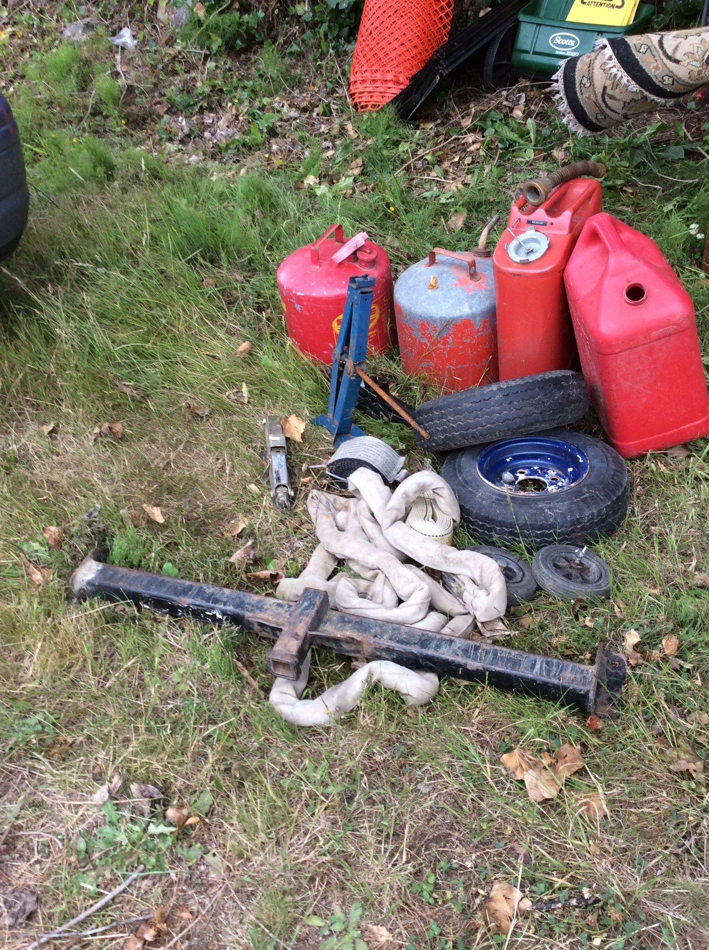 Gas can lot, tow straps, car jacks, trailer tires(2), tow hitch