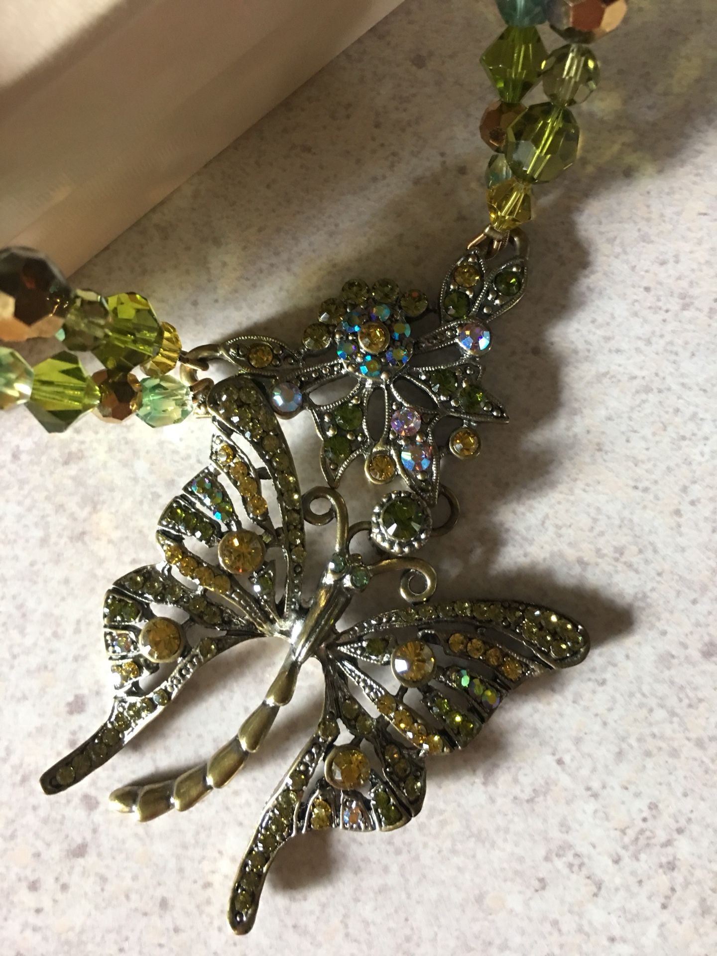 Kirks and Folly jewelry. High quality. In original box. Green butterfly.