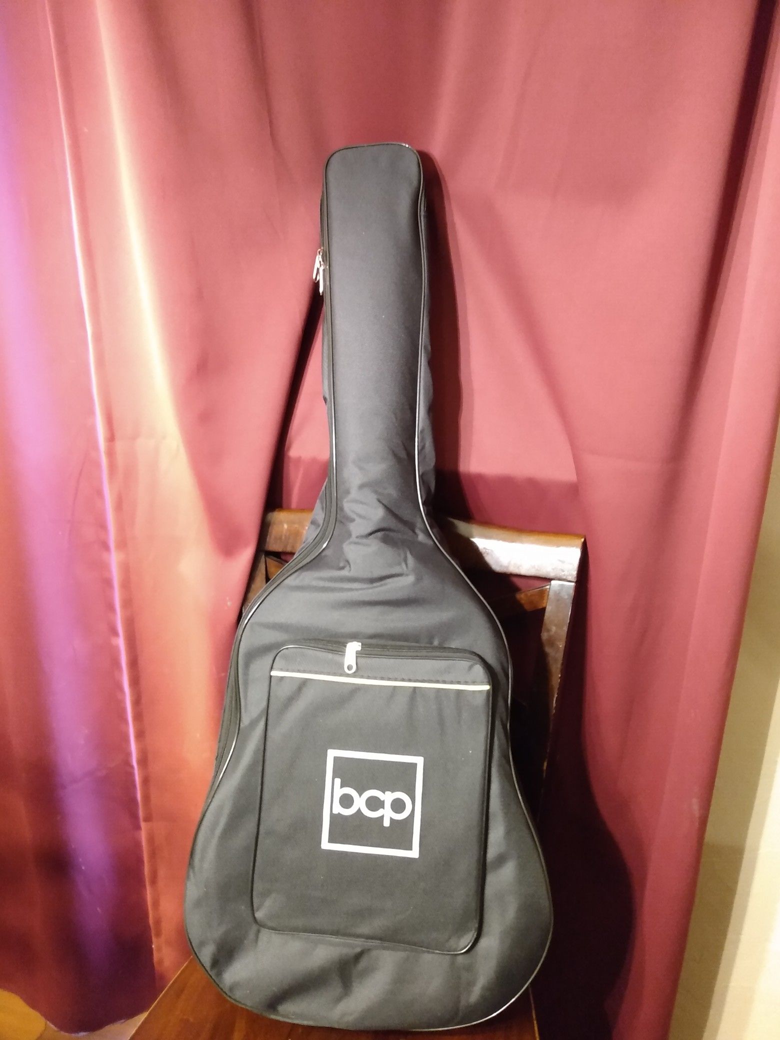 Brand new acoustic guitar, gig bag, extras
