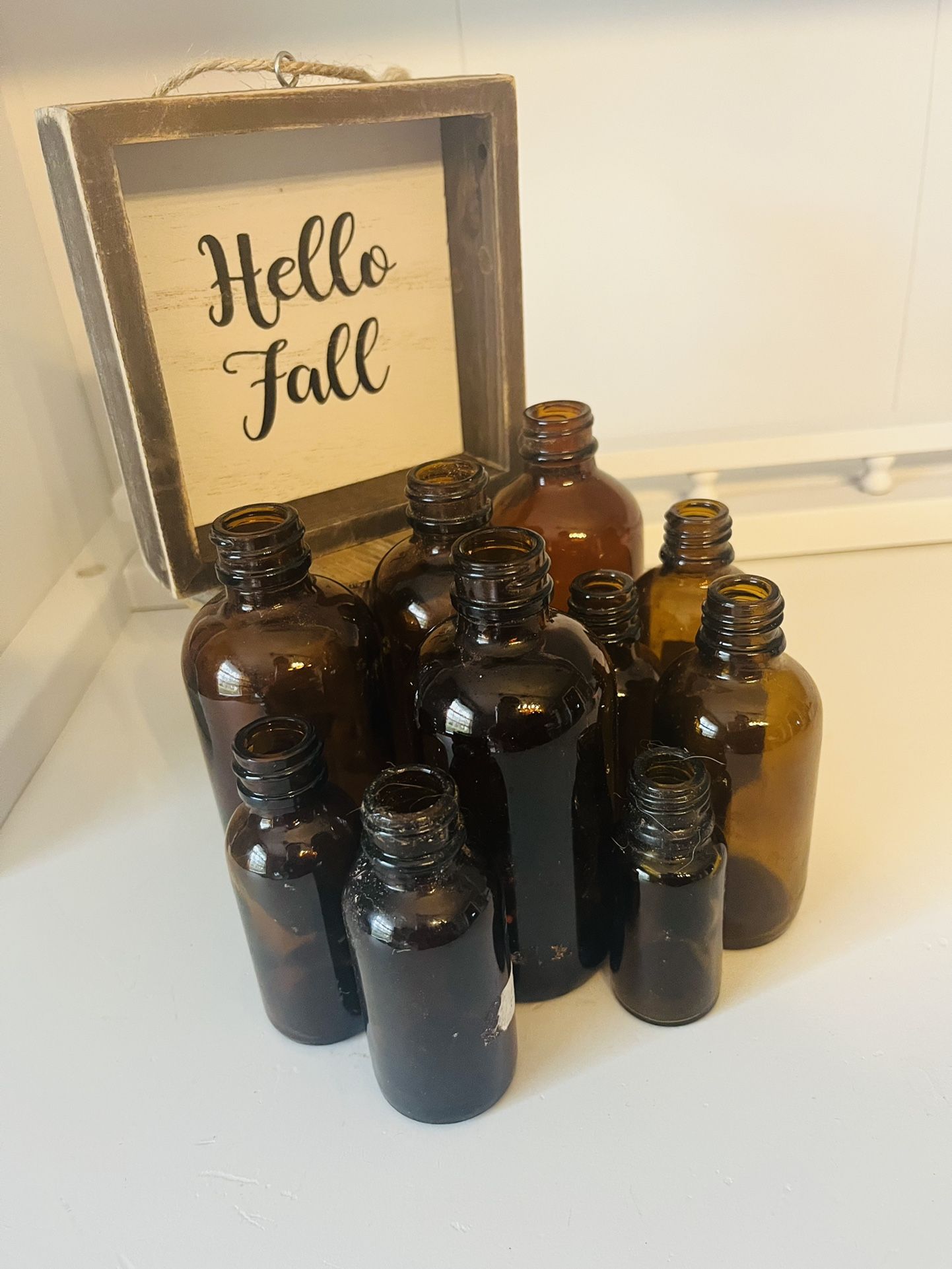 Small Amber Bottles And Small Sign