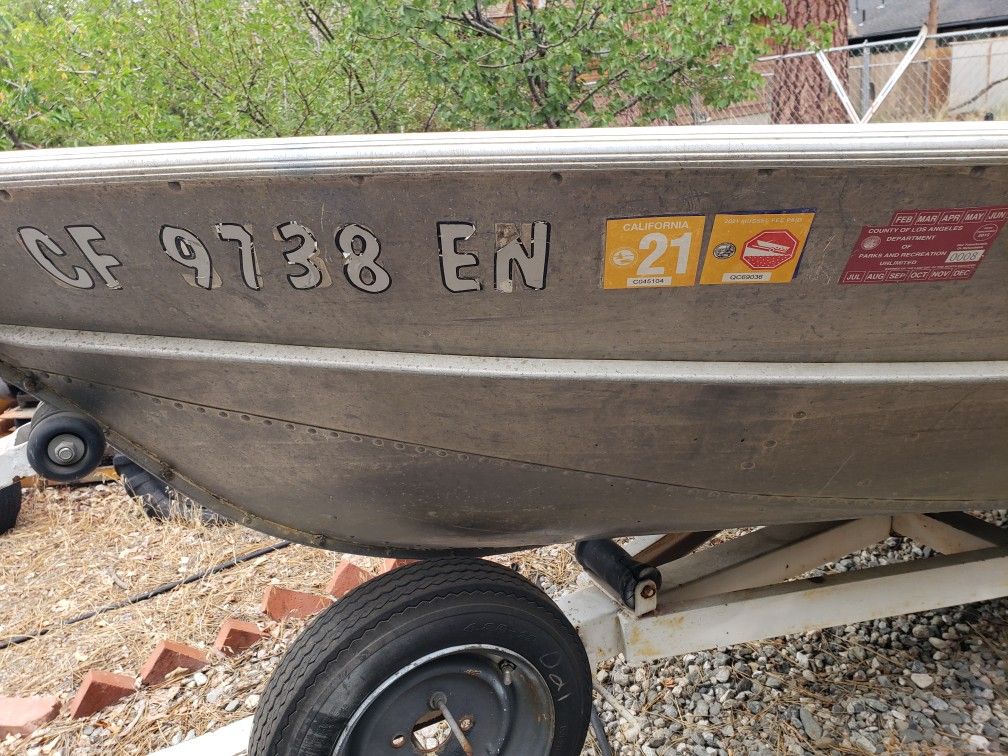 Valco Aluminum boat with 8 HP mariner motor ready for fishing trailer and new tires.
