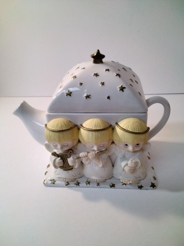 A Beautiful Tea Pot With Angels .
