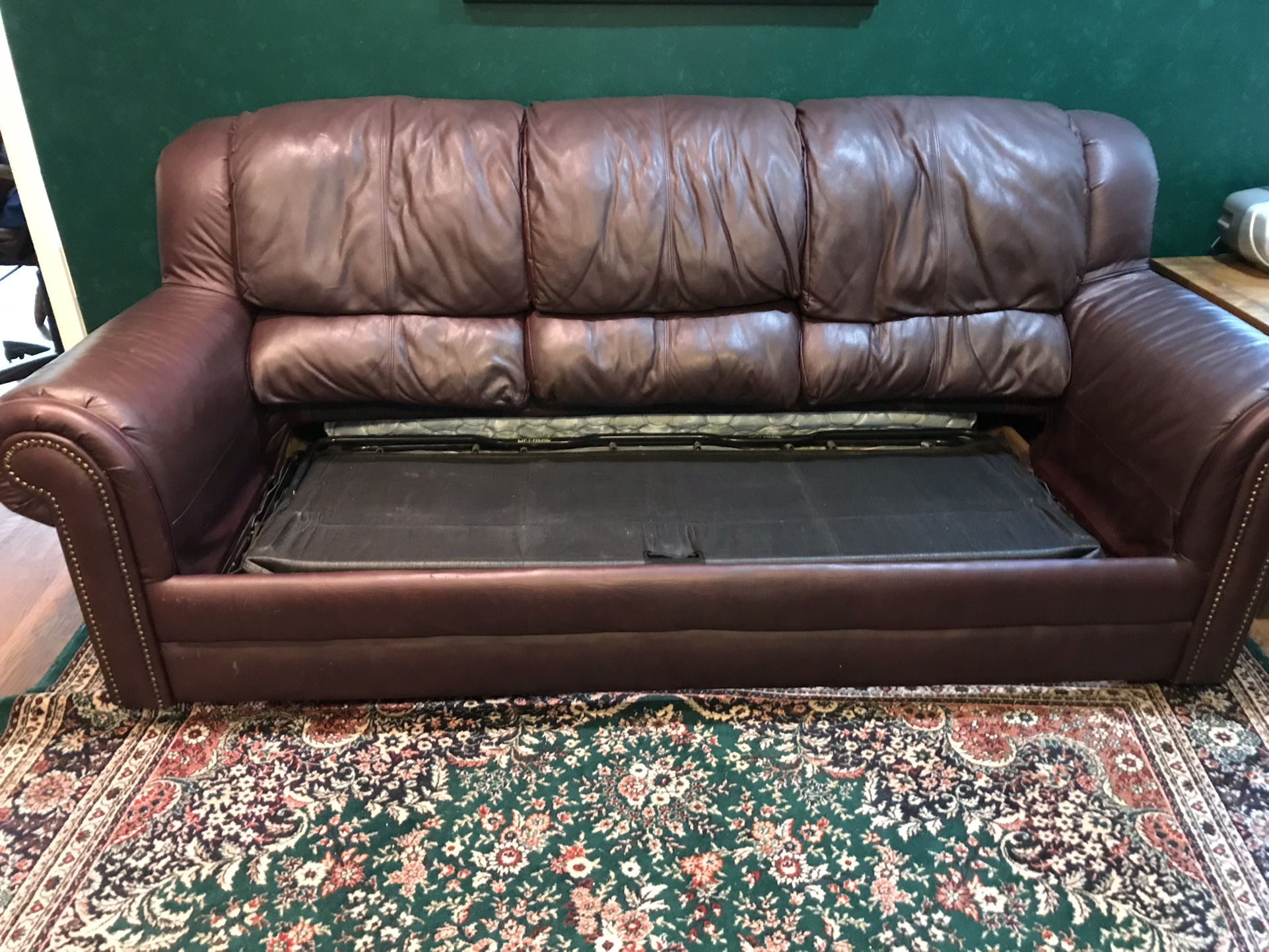 Burgundy Faux leather sofa couch with pull out mattress/bed sleeper