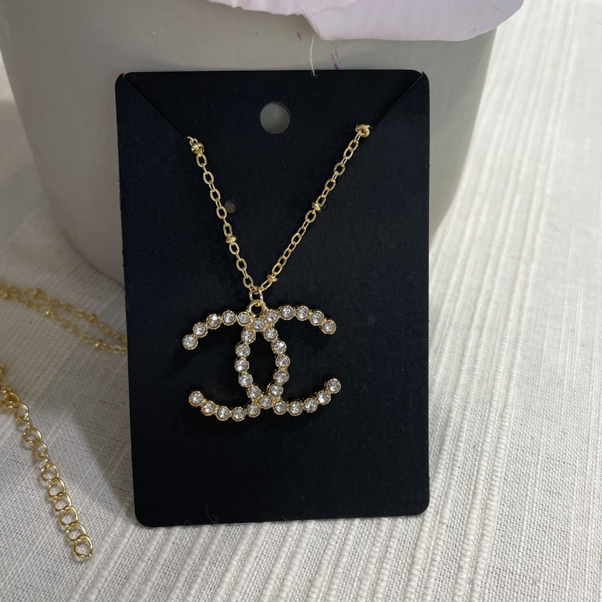 Fashion CC Gold tone necklace approximate length 13 inches