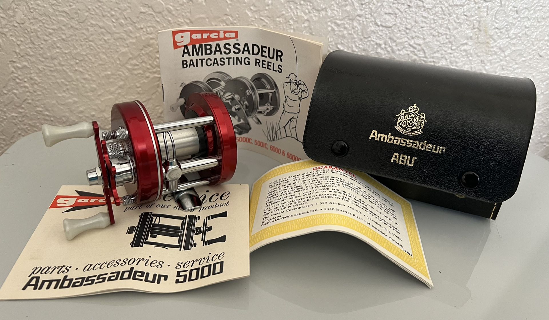 VINTAGE Red ABU GARCIA AMBASSADEUR 5000 BAIT CASTING FISHING REEL - New In Box