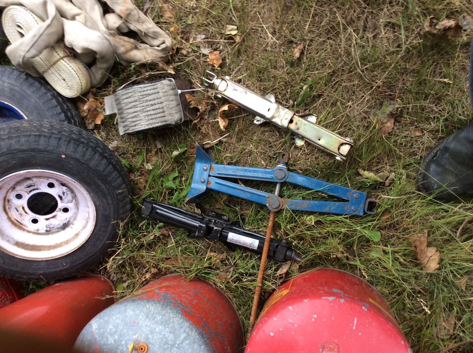 Gas can lot, tow straps, car jacks, trailer tires(2), tow hitch