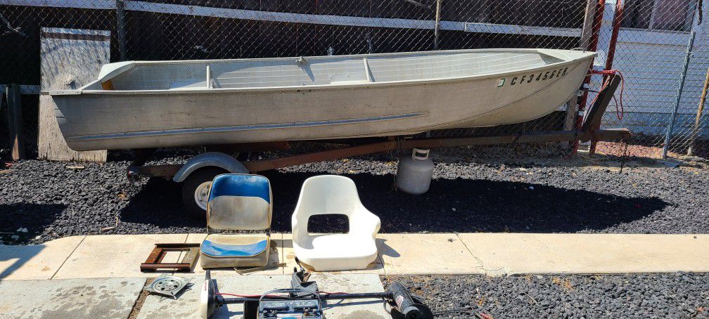 14 ft Sears aluminum boat w/folding trailer and extras.